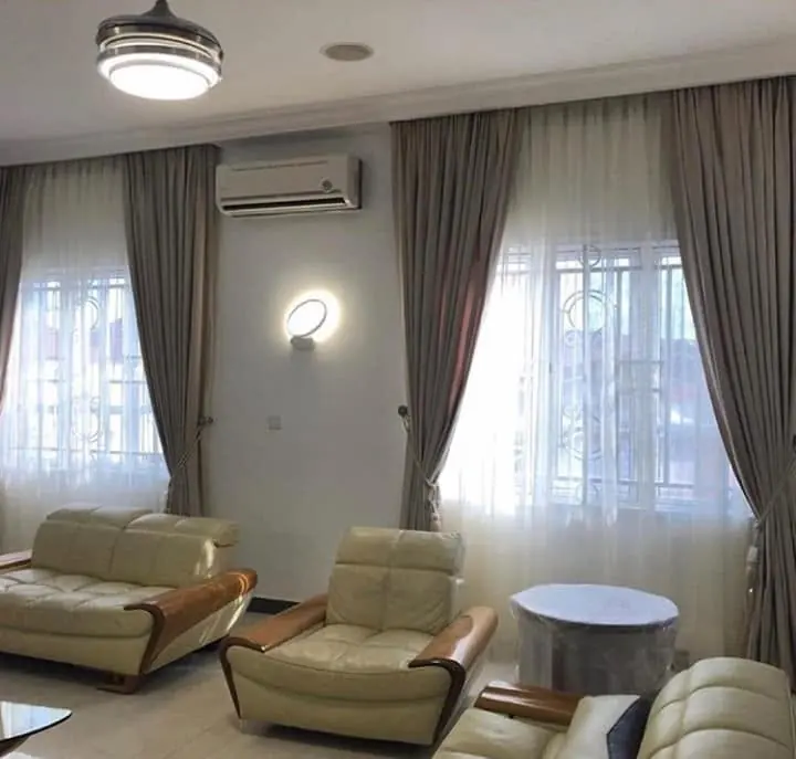 Charcoal curtains over sheers