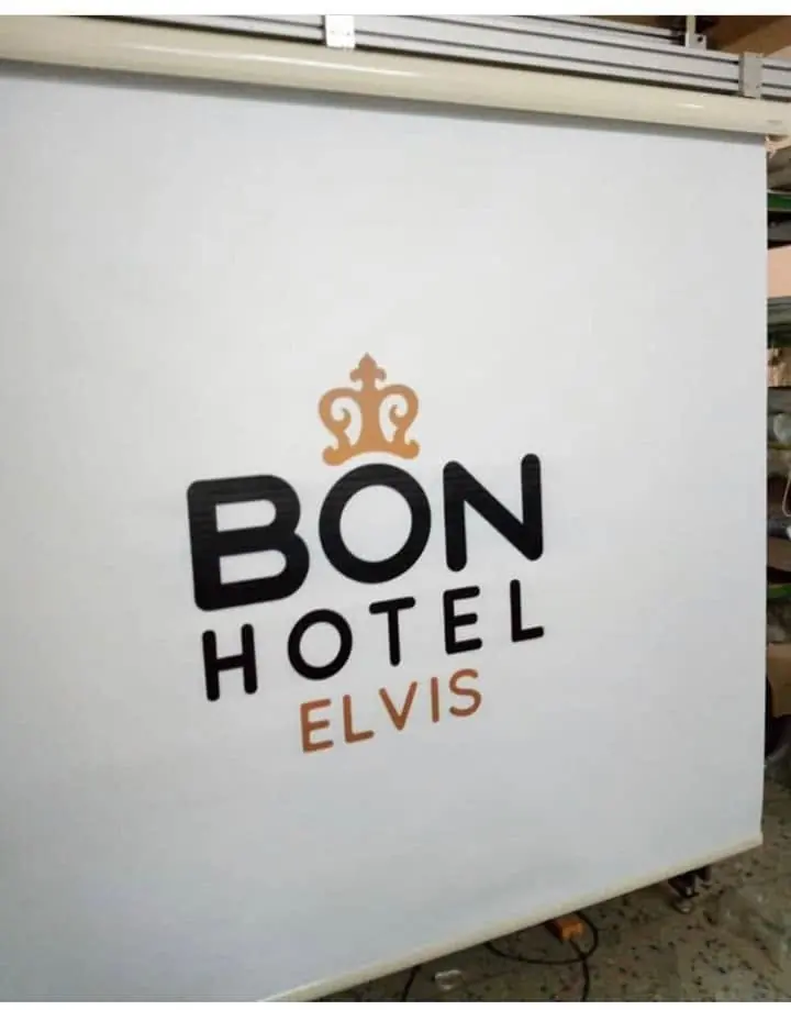 Hotel logo printed on a white roller blind