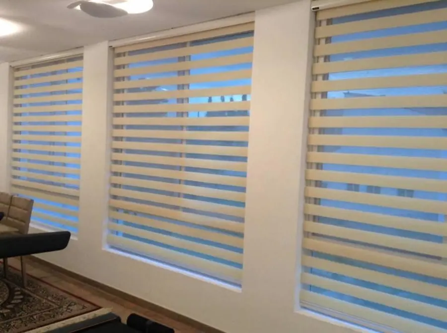 Blue and cream zebra blinds in a living room