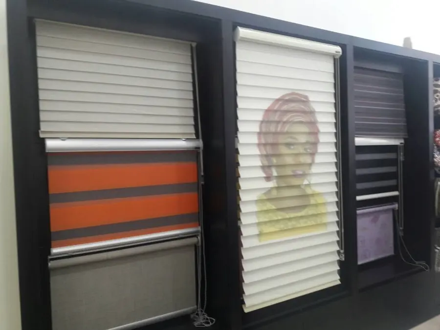 Showroom wall of roller and zebra blinds